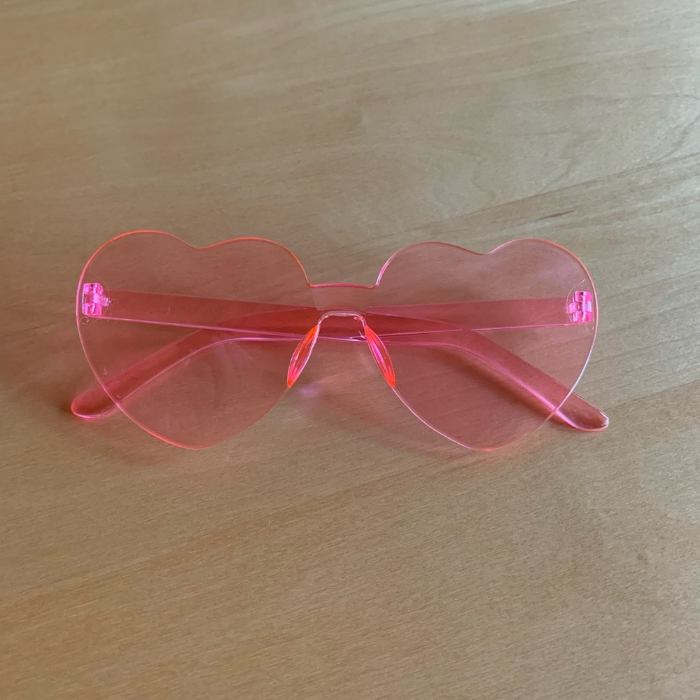 Pink heart shaped plastic sunglasses.